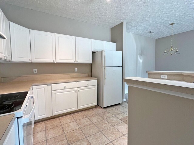 6155 Pelican Pointe Unit 103, Columbus, OH 43231 - kitchen featuring white appliances, a chandelier, white cabinetry, and a textured ceiling