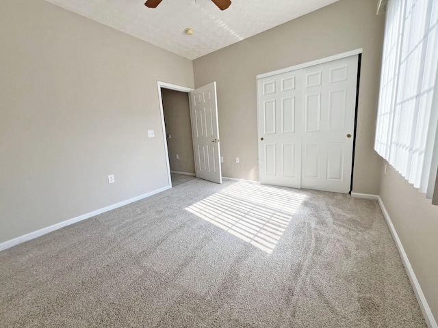 6155 Pelican Pointe Unit 103, Columbus, OH 43231 - unfurnished bedroom featuring carpet floors, baseboards, ceiling fan, and a closet