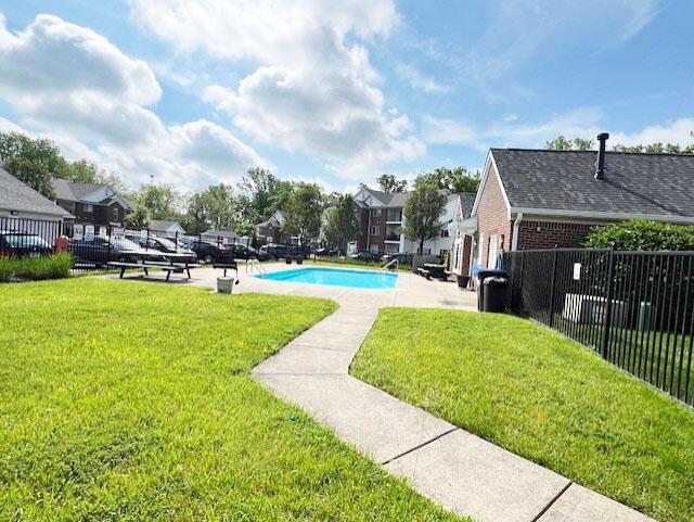 6155 Pelican Pointe Unit 103, Columbus, OH 43231 - view of swimming pool featuring a patio area and a residential view