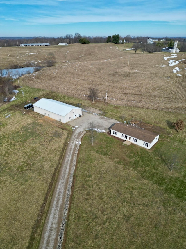 birds eye view of property featuring a rural view