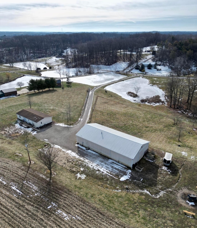 snowy aerial view featuring a rural view