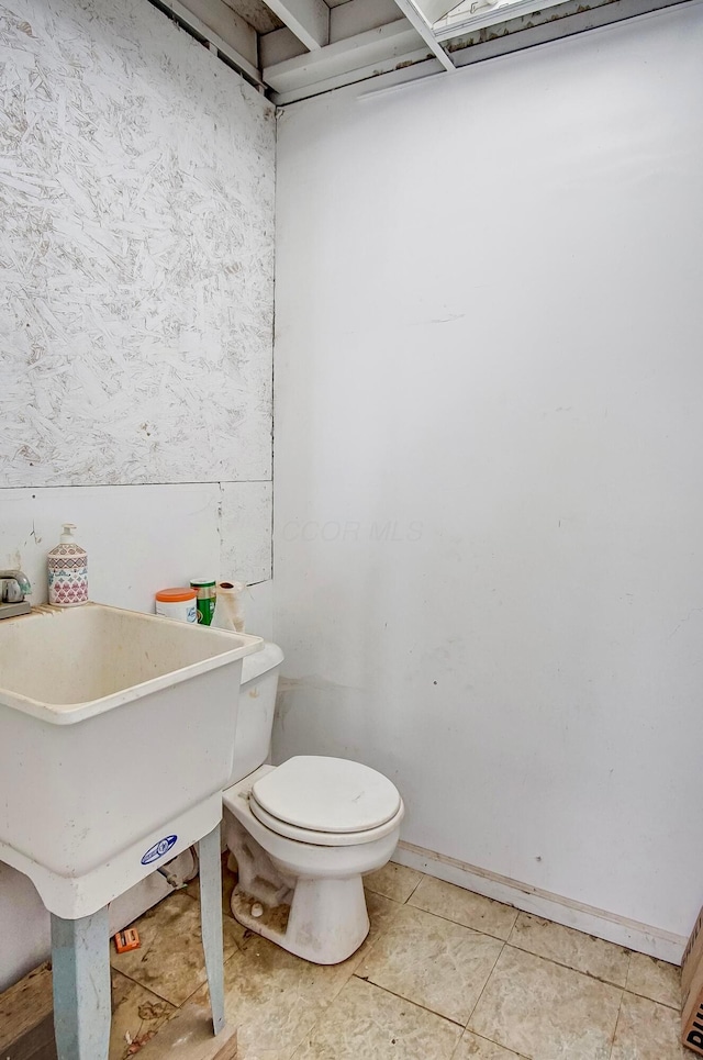 bathroom featuring tile patterned floors and toilet