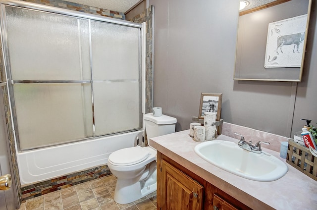 full bathroom with vanity, enclosed tub / shower combo, and toilet