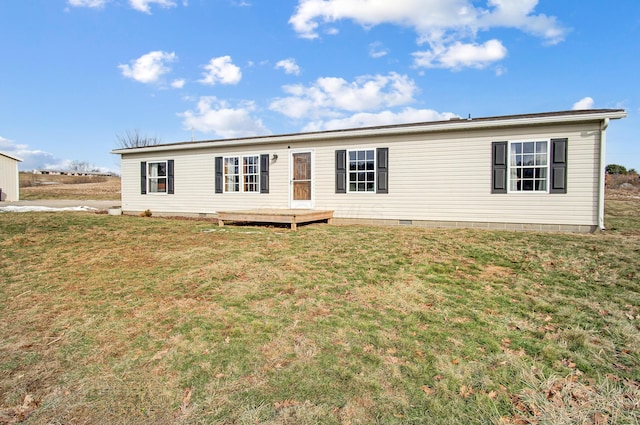 view of front of property with a front lawn and a deck