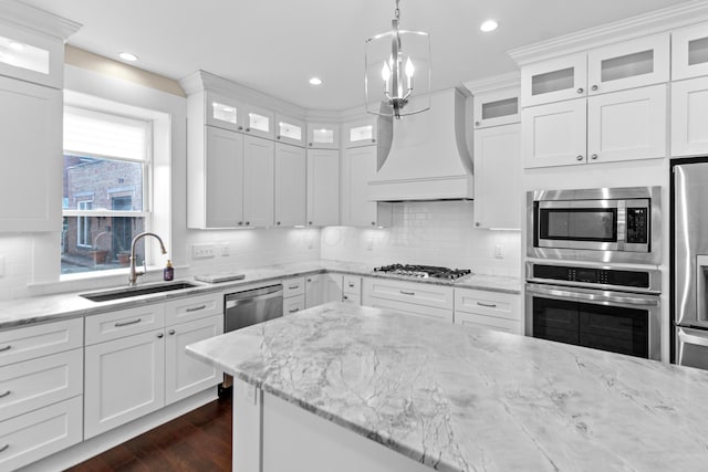 kitchen with white cabinetry, sink, and stainless steel appliances