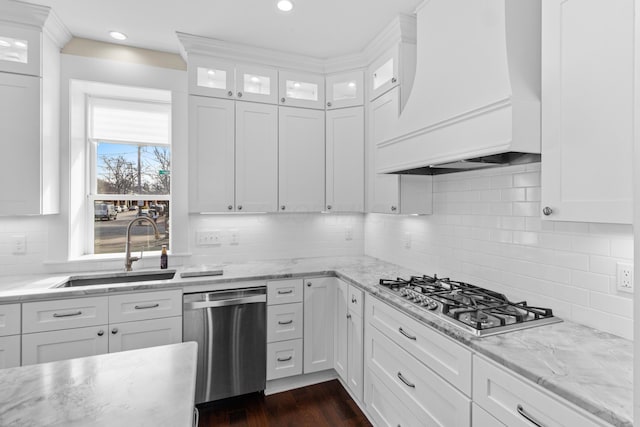 kitchen with premium range hood, appliances with stainless steel finishes, and white cabinets