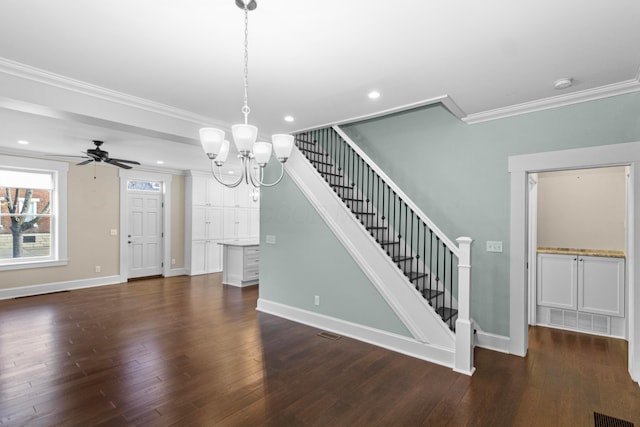 interior space featuring hardwood / wood-style flooring, ornamental molding, and ceiling fan with notable chandelier