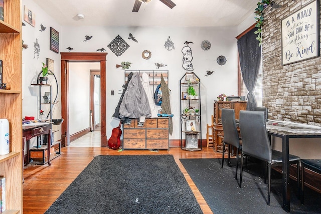 office with wood-type flooring and ceiling fan