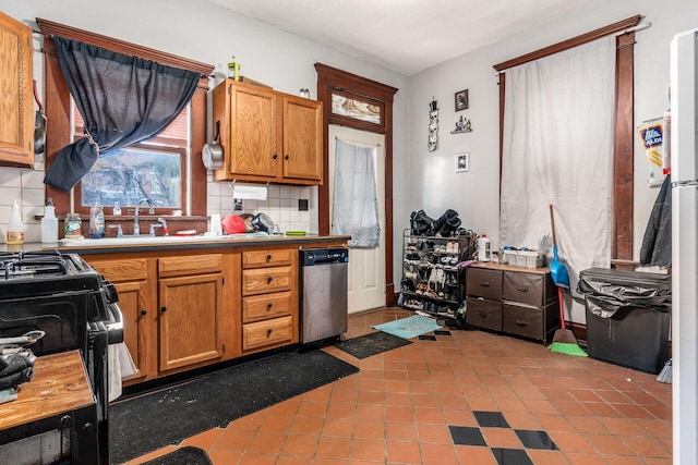 kitchen with black gas stove, stainless steel dishwasher, and backsplash