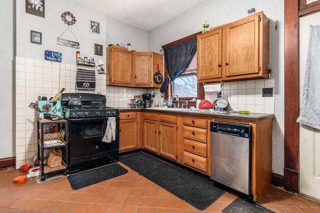 kitchen featuring sink, stainless steel dishwasher, black range with gas stovetop, tile patterned flooring, and backsplash