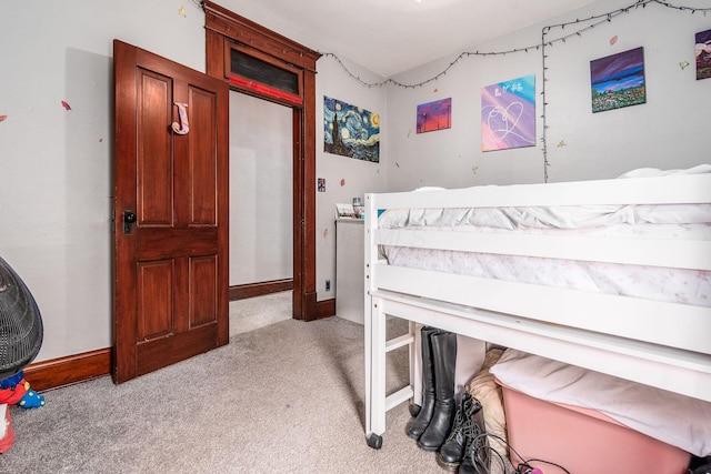 bedroom featuring light carpet