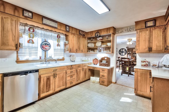 kitchen featuring dishwasher, sink, backsplash, and ceiling fan