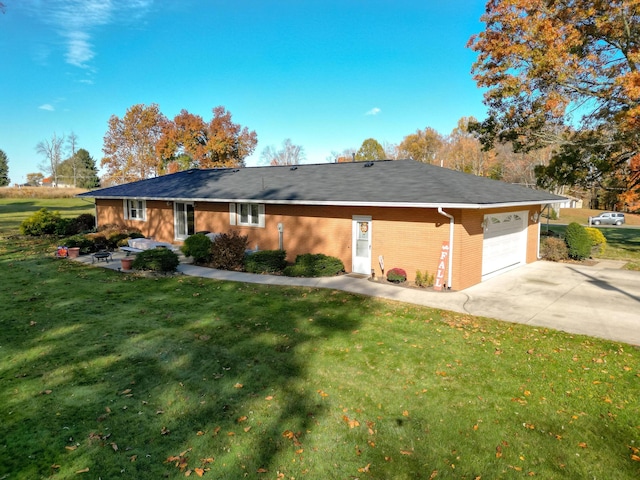 view of front of property with a garage and a front yard