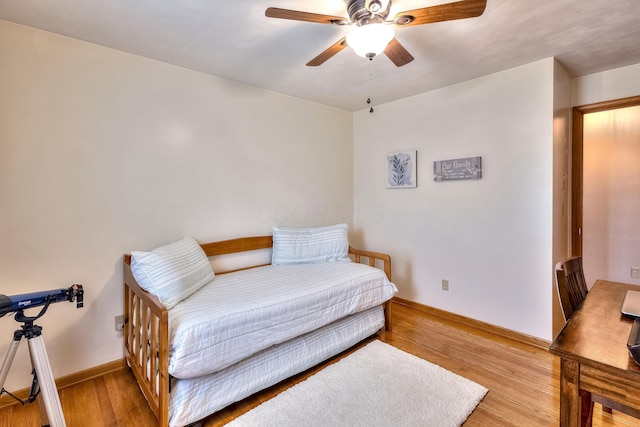 bedroom featuring ceiling fan and light hardwood / wood-style flooring