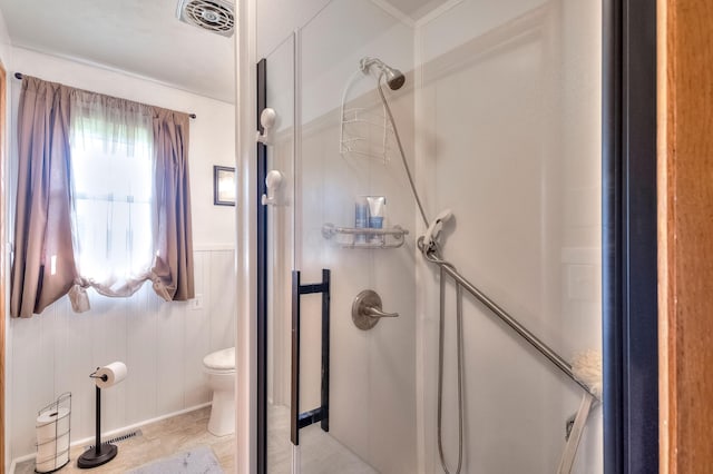 bathroom with toilet and walk in shower