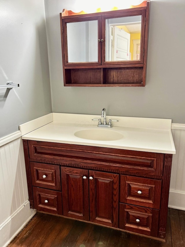 bathroom with vanity and hardwood / wood-style floors