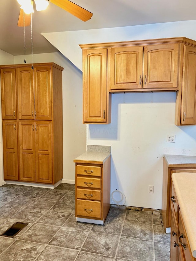 kitchen featuring ceiling fan