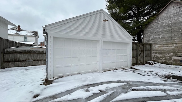 view of snow covered garage