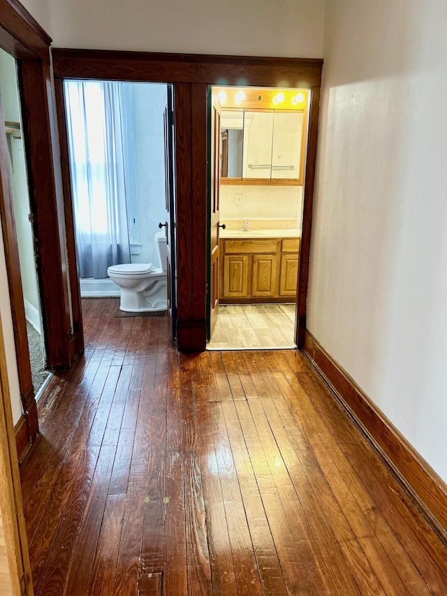 hallway featuring wood-type flooring