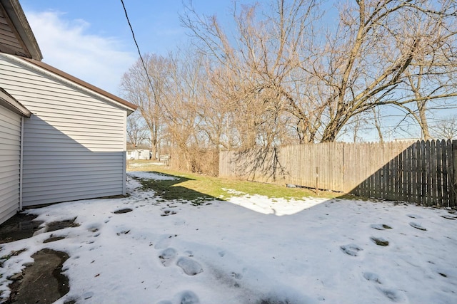 view of yard covered in snow