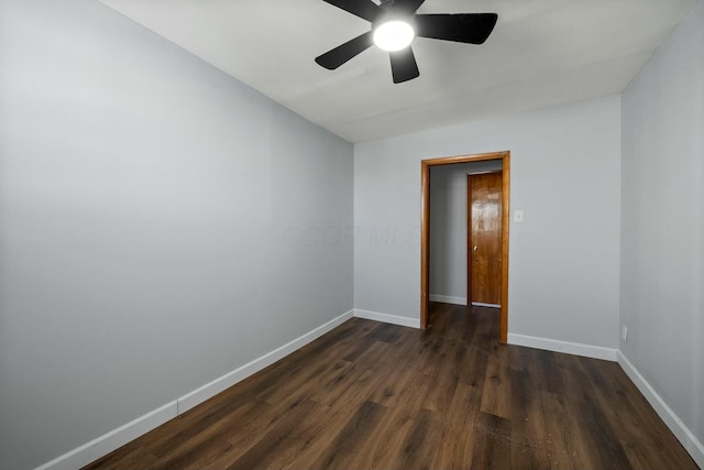 unfurnished room with dark hardwood / wood-style floors and ceiling fan