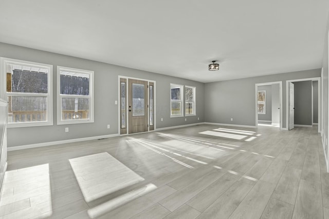 spare room featuring light wood-type flooring