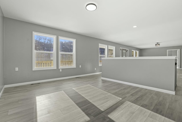 unfurnished room featuring light hardwood / wood-style flooring