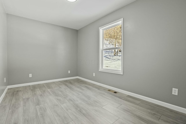 empty room with light wood-type flooring