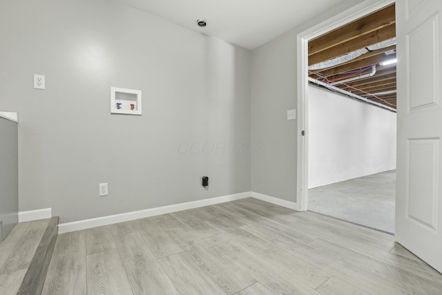 laundry area featuring light hardwood / wood-style floors and hookup for a washing machine