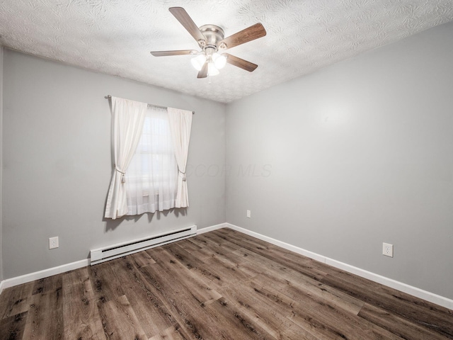 spare room featuring ceiling fan, a baseboard radiator, wood-type flooring, and a textured ceiling