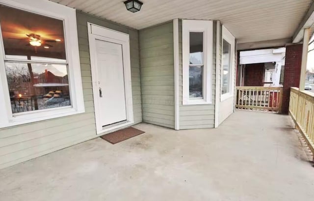 property entrance with covered porch