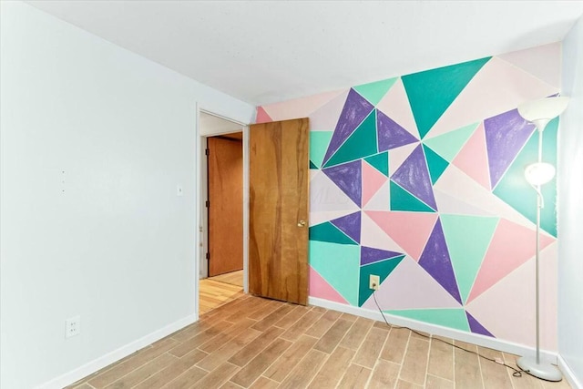 spare room featuring hardwood / wood-style floors