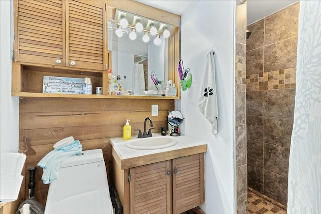 bathroom featuring vanity, curtained shower, and toilet