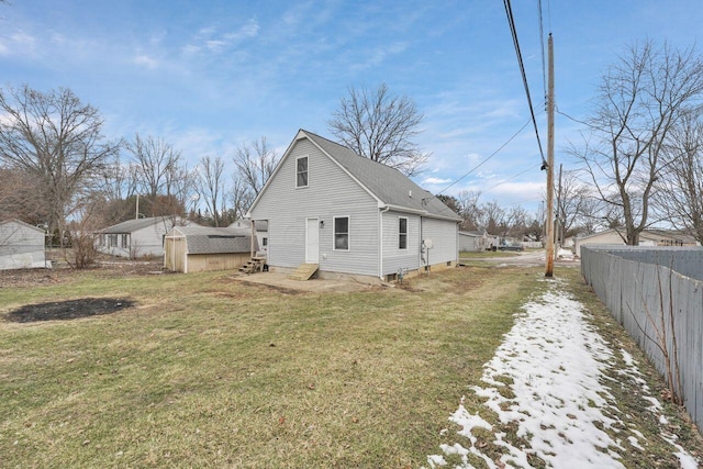 view of side of home featuring a yard