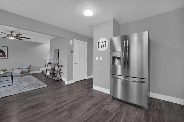 kitchen with ceiling fan, stainless steel fridge, dark hardwood / wood-style flooring, and a textured ceiling