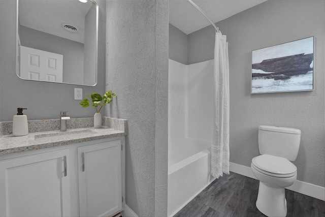 full bathroom featuring hardwood / wood-style flooring, vanity, toilet, and shower / bath combo