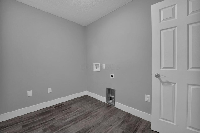 laundry area with dark hardwood / wood-style floors, hookup for a washing machine, a textured ceiling, and electric dryer hookup