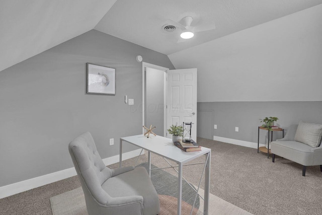 carpeted office with ceiling fan and vaulted ceiling