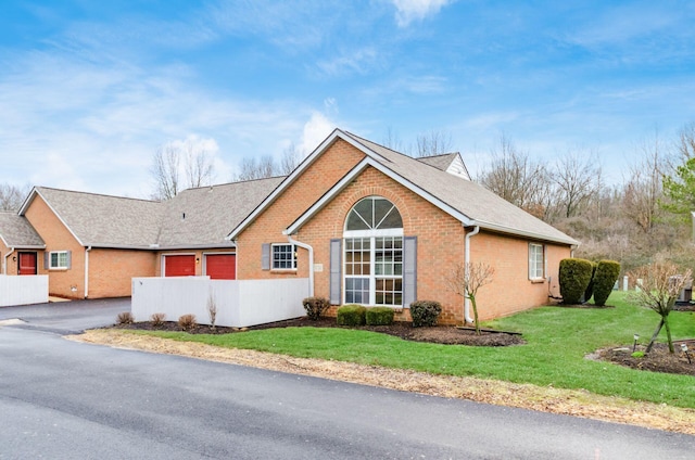 view of property exterior with a lawn