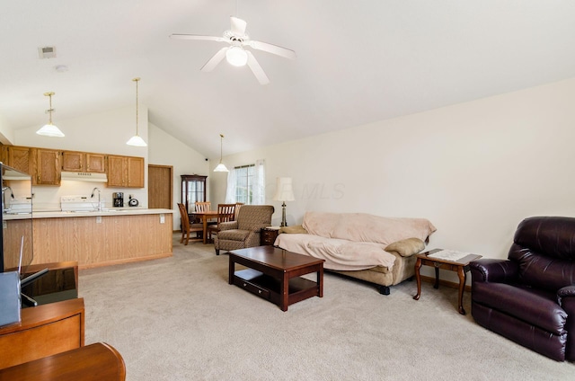 living room with ceiling fan, sink, light carpet, and high vaulted ceiling