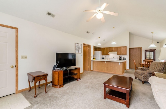 living room featuring ceiling fan, high vaulted ceiling, and light colored carpet