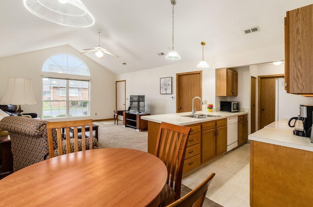 kitchen with sink, white appliances, ceiling fan, hanging light fixtures, and vaulted ceiling