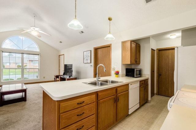 kitchen featuring sink, vaulted ceiling, hanging light fixtures, ceiling fan, and white appliances