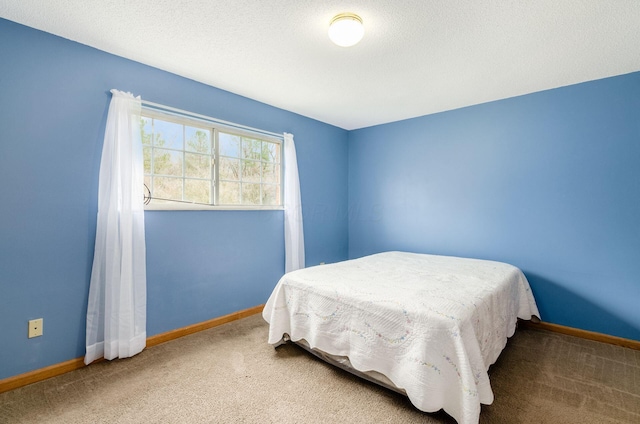 carpeted bedroom with a textured ceiling