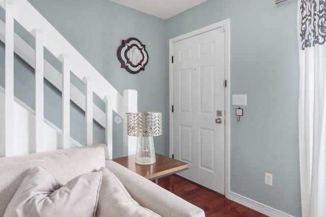 foyer with dark hardwood / wood-style flooring