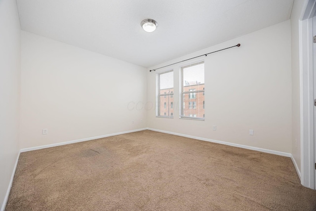 unfurnished room with carpet floors