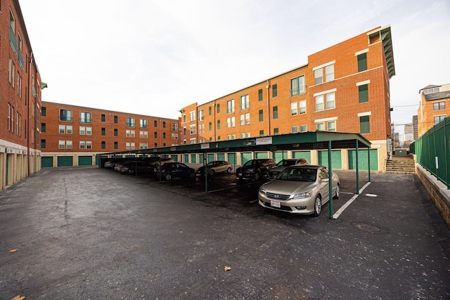 view of vehicle parking with a carport