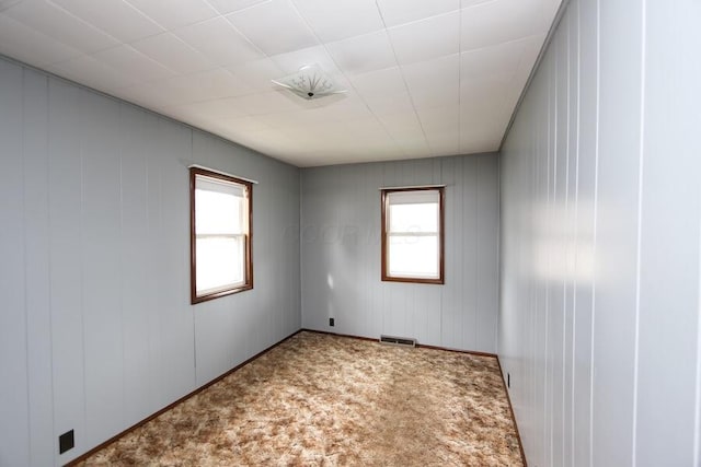 unfurnished room featuring carpet floors