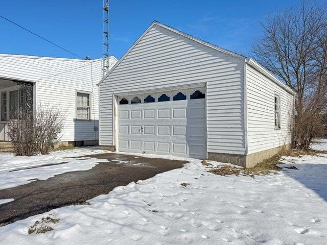 view of snow covered garage