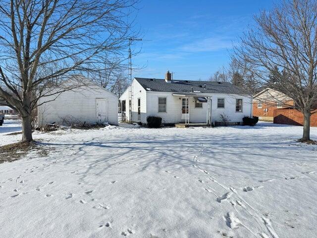 view of snow covered house